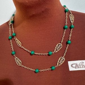 3/ $18  40” Vintage long necklace with green beads and goldstone leaves